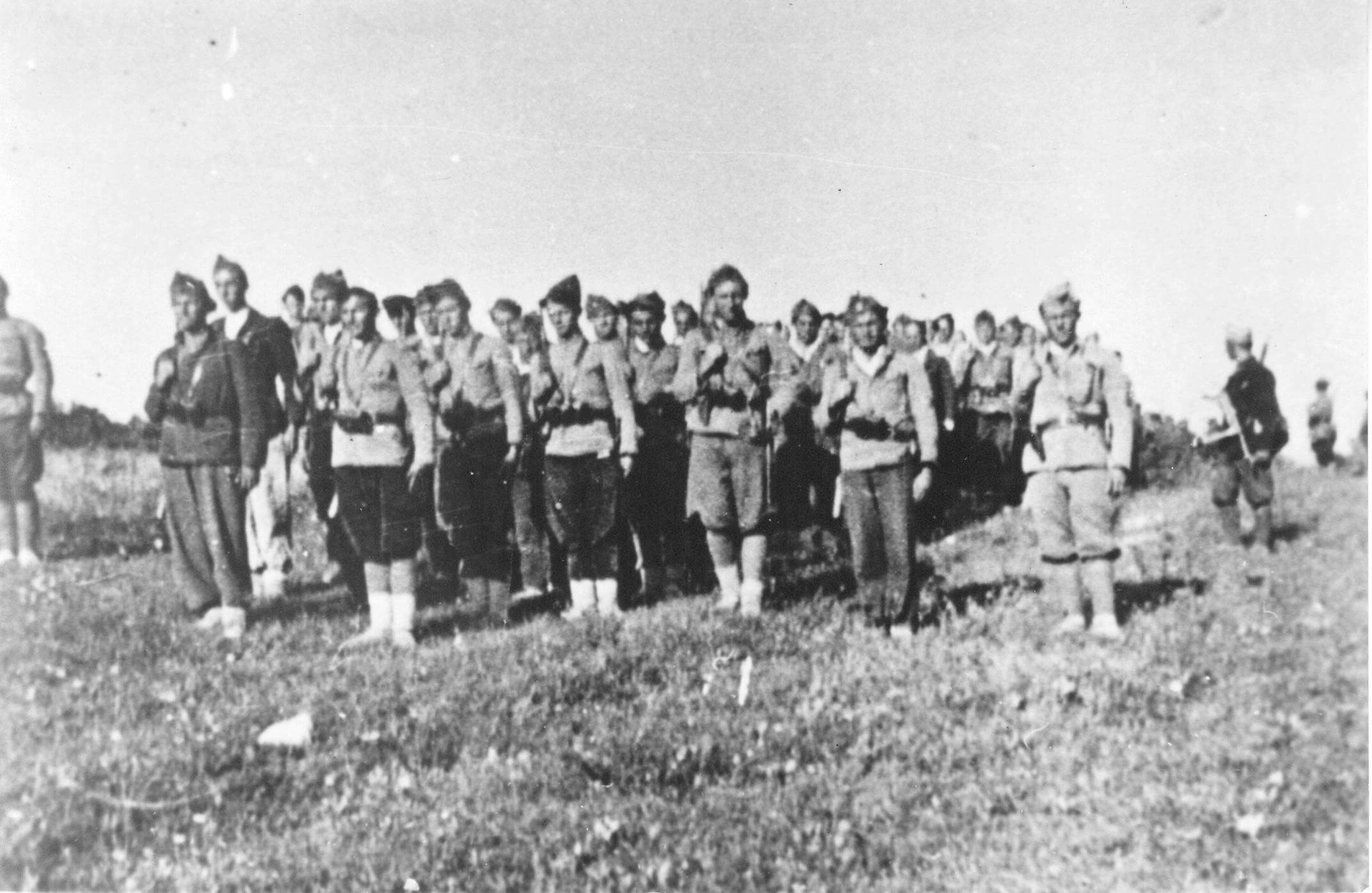 The First Krajina National Liberation Brigade was formed in Lamovita, beneath Kozara, on May 21, 1942. It was composed of fighters from the wider Bosnian Krajina region. The photo depicts a part of the brigade on the day of its formation, lined up in front of the elementary school.