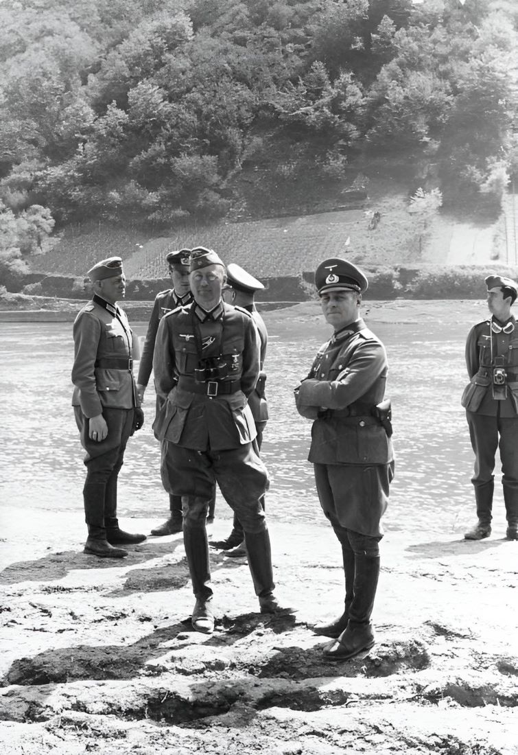 General Erwin Rommel and his staff observe troops of the 7th Panzer Division practising a river crossing at the Moselle River in France in 1940