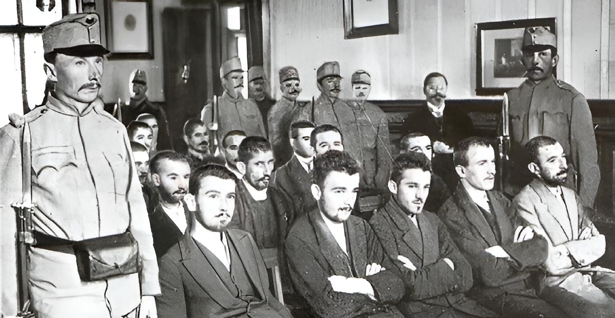 Princip, seated centre of first row, during the trial._restored