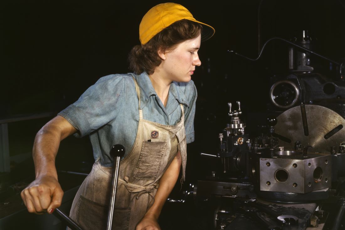 A woman operating a turret lathe (1942)