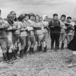 Deputy Commander of the 46th Guards Night Bomber Aviation Regiment S. Amosova assigns a combat mission to the female pilots.