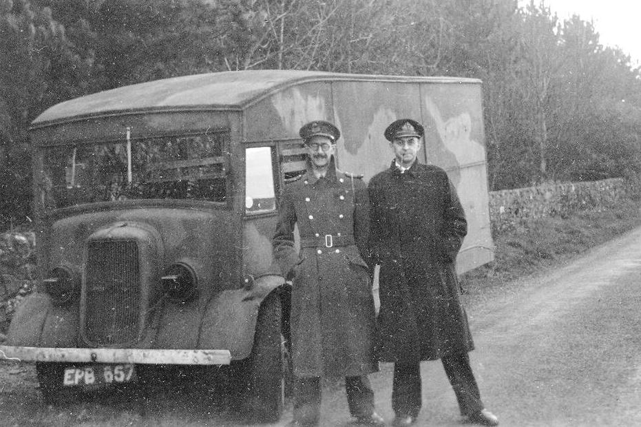 Charles Cholmondeley and Ewen Montagu on 17 April 1943, transporting the body to Scotland