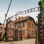 Gate to Auschwitz I with its Arbeit macht frei sign - work sets you free